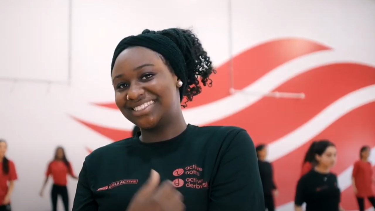 Image of a young black girl enjoying physical activity on our Girls Active programme