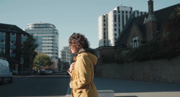 Woman walks through City