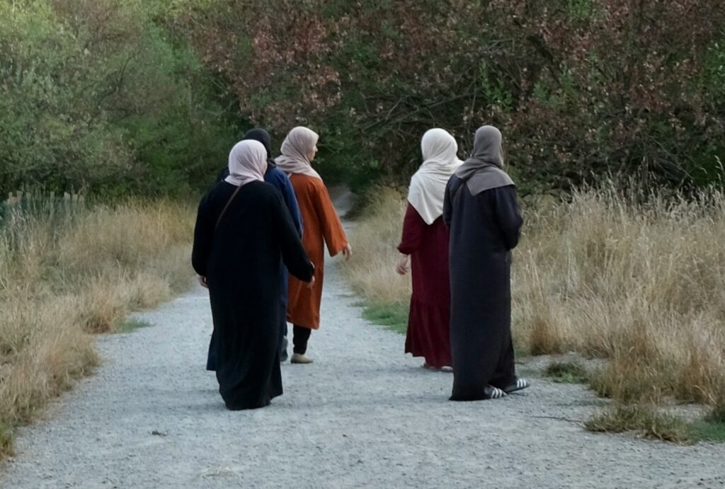 Muslim women walking in nature