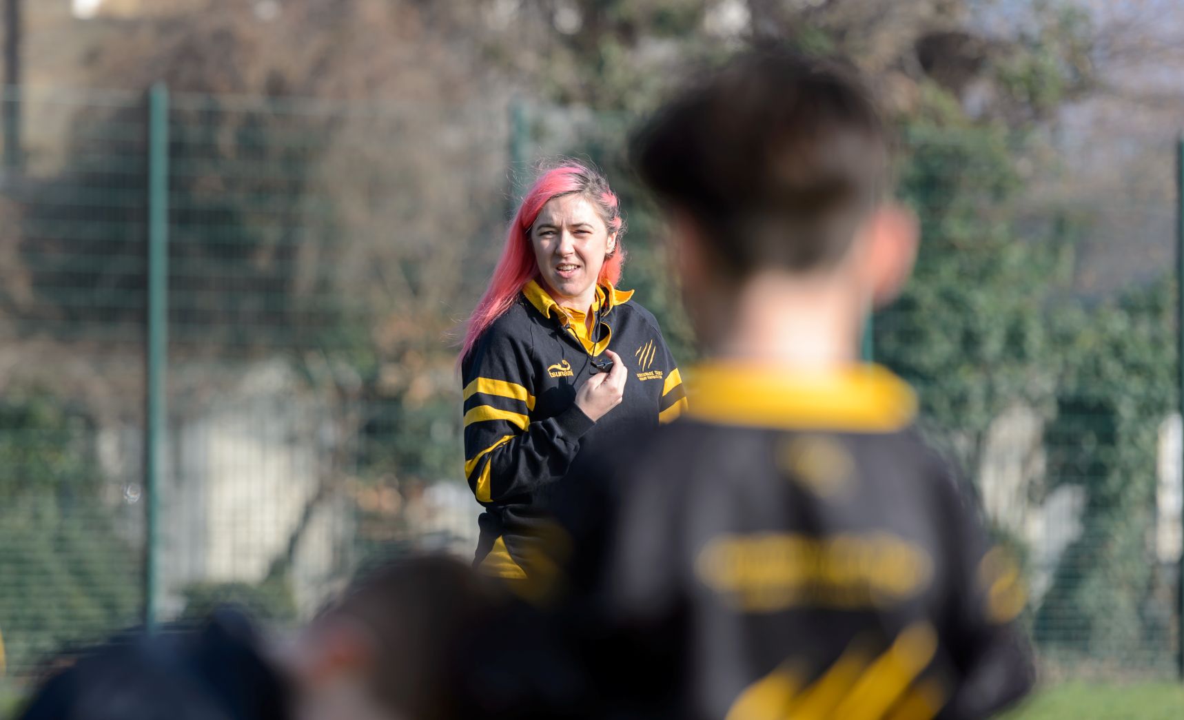 A young woman coaching sport
